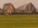We knew when we were close to Tam Coc about two hours south of Hanoi when we saw these giant rocks appear in the rice fields. We were back in karst country.